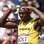 Bolt faz graça antes das eliminatórias dos 100 m . Foto: AP