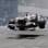 Após toque da Lotus, Kamui Kobayashi voa com sua Sauber. Foto: AP