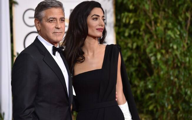 George e Amal Clooney no tapete vermelho do Globo de Ouro. Foto: AP