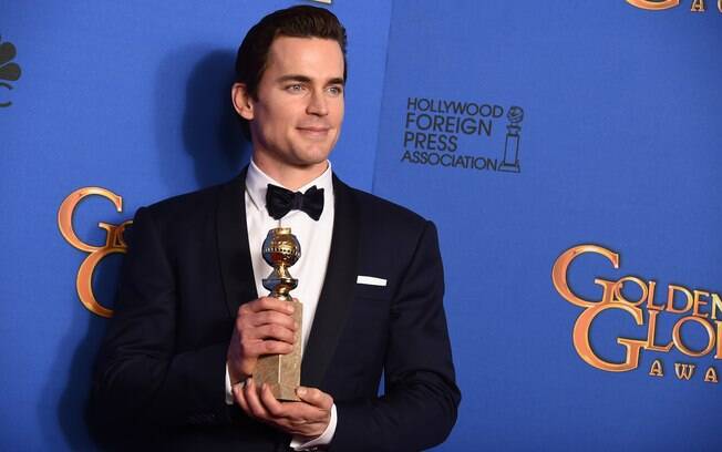 Matt Bomer com o prêmio de melhor ator coadjuvante de televisão por 'The Normal Heart'. Foto: AP