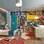 Na Suite do Menino, projetada por Gerson Dutra na Casa Cor, o televisor fica suspenso sobre a cama. Foto: Divulgação