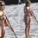 Cindy Crawford ainda tímida e de vestido em cima da prancha. Foto: SplashNews