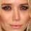 Para os olhos verdes uma boa pedida são os tons avermelhados, contrastantes, como no look de Mary-Kate Olsen. Foto: Getty Images