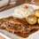 Pargo em crosta de castanhas, purê de alho-poró e gengibre, no Esquinica. Foto: Divulgação/Restaurant Week SP
