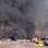 Chamas e fumaça são vistas em local de ataque no centro de Damasco, Síria (21/02). Foto: AP