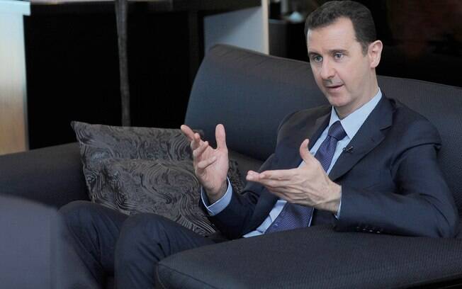 Assad alerta para risco de guerra regional se Síria for alvo de ataque militar