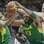 Anderson Varejão e Nenê lutam pela posse de bola com o britânico Dan Clark. Foto: AP