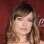 Olivia Wilde linda com o cabelo médio e a franja desfiada invadindo a linha da sobrancelha. Foto: GettyImages
