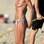 Adepta do topless pelo mundo: Heidi Klum em uma praia da França. Foto: Reprodução