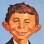 O mascote Alfred E. Neuman em uma de suas primeiras aparições e na capa do livro de 60 anos da MAD. Foto: Divulgação