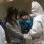 Criança passa por exame de radiação em centro de testes em Fukushima, Japão (15/03)