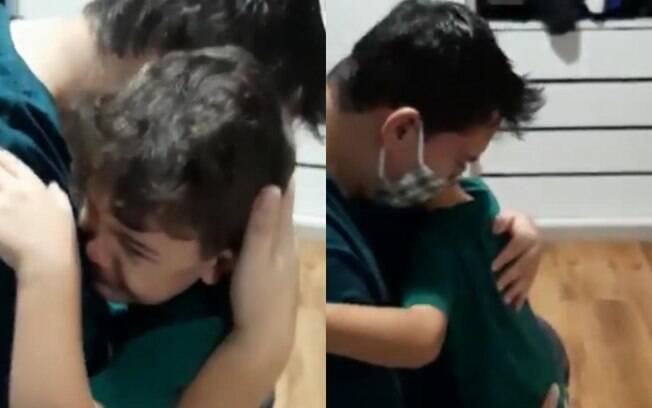 Após reconhecer o pai e entender o que está acontecendo, menino abraça o pai e ambos choram