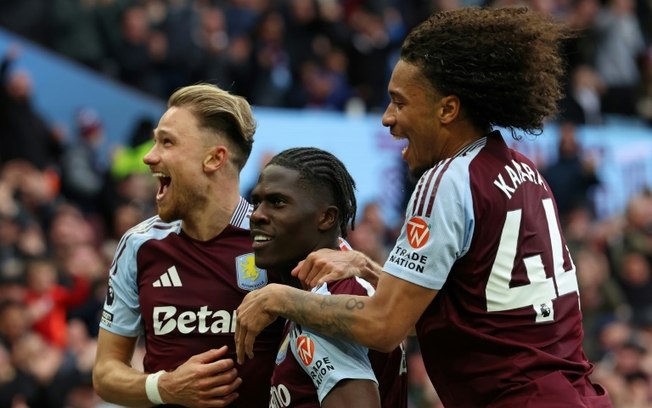Amadou Onana (centro) comemora com os companheiros de equipe após marcar para o Aston Villa na vitória da Premier League sobre o Newcastle em Birmingham, em 19 de abril de 2025 Amadou Onana (centro) comemora com os companheiros de equipe após marcar para o Aston Villa na vitória da Premier League sobre o Newcastle em Birmingham, em 19 de abril de 2025