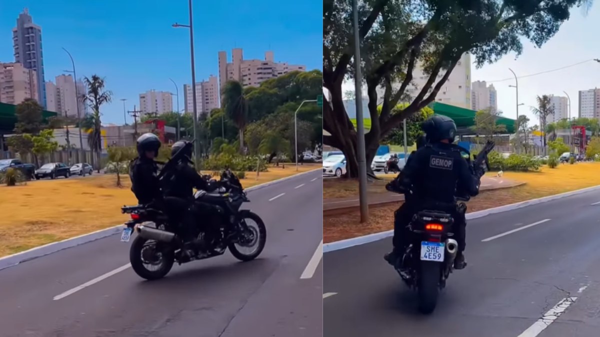 Policial com metralhadora fazendo escolta