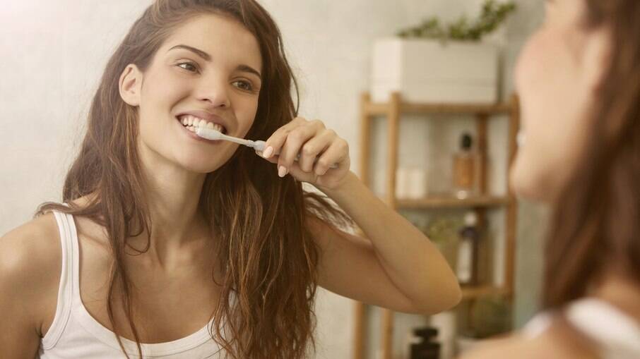 escovar os dentes
