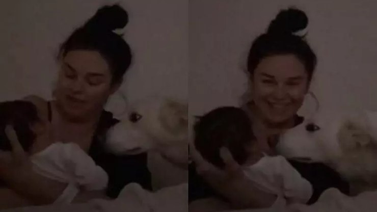 Mãe de primeira viagem amamenta com cachorro do lado e viraliza