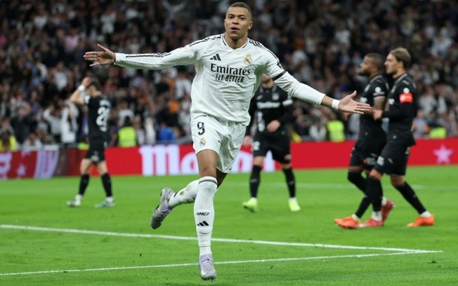 O atacante francês do Real Madrid, Kylian Mbappé, comemora um gol de pênalti contra o Leganés no Bernabéu em 29 de março de 2025. O atacante francês do Real Madrid, Kylian Mbappé, comemora um gol de pênalti contra o Leganés no Bernabéu em 29 de março de 2025.