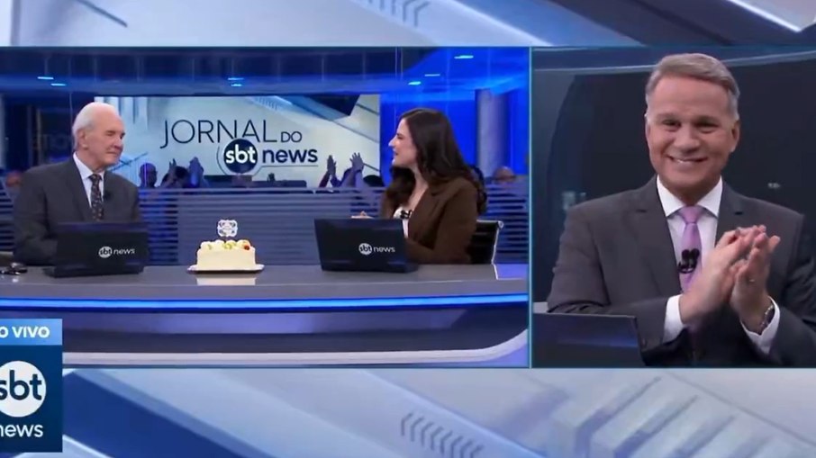 Momento em que o jornalista do SBT News recebe o bolo ao vivo durante o jornal Momento em que o jornalista do SBT News recebe o bolo ao vivo durante o jornal