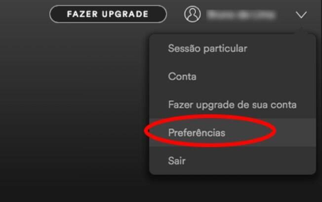 Na página inicial do aplicativo do Spotify, abra o menu suspenso localizado logo ao lado do seu nome de usuário e clique em 