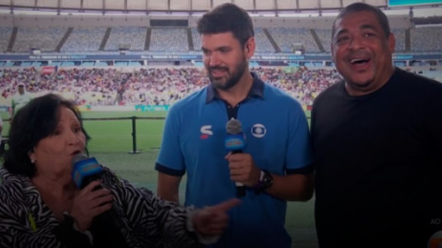 Dona Déa fala com Vampeta no intervalo do Futebol Solidário