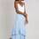 Saia Feminina Mindset Midi Assimétrica Com Babados Azul Claro | R$ 149,90. Foto: Divulgação