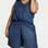 Macaquinho Feminino Jeans Sem Manga Plus Size | Marisa | R$ 139,90. Foto: Divulgação