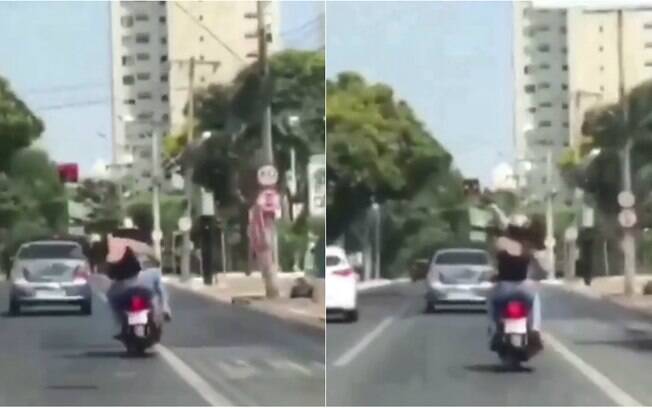 Vídeo gravado por motorista de carro mostra casal trocando socos e cotovelada em cima de moto