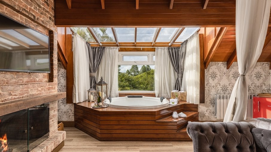 A bathtub with a glass ceiling is the highlight of the suite
