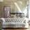 Já no apartamento de Bruna Linzmeyer, a atriz mescla estampas e texturas; seu sofá florido cria um contraste despojado com a parede de concreto. Foto: Reprodução/Casa Vogue
