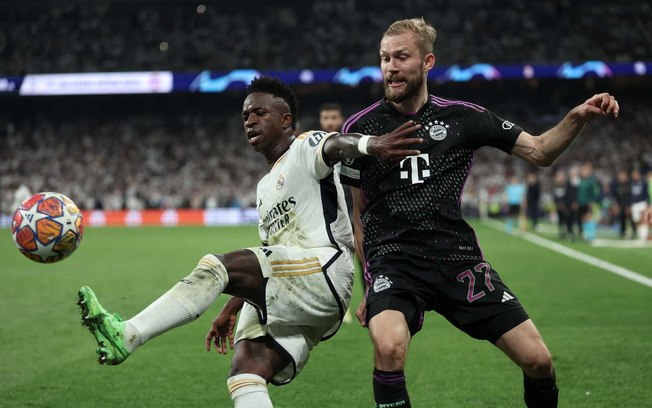 Vini Jr em disputa de bola com jogador do Bayern na semifinal da Champions - Foto: Thomas Coex/AFP via Getty Images