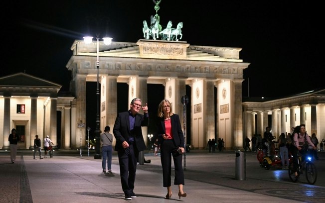 British Prime Minister Keir Starmer poses with UK Ambassador to Germany Jill Gallard at the Brandenburg Gate in Berlin on August 27, 2024