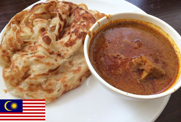 2º lugar - Roti Canai (Malásia) - Pão achatado servido com curry que tem variações doces e salgadas e pode levar carne, ovos ou queijo.  Reprodução: Flipar