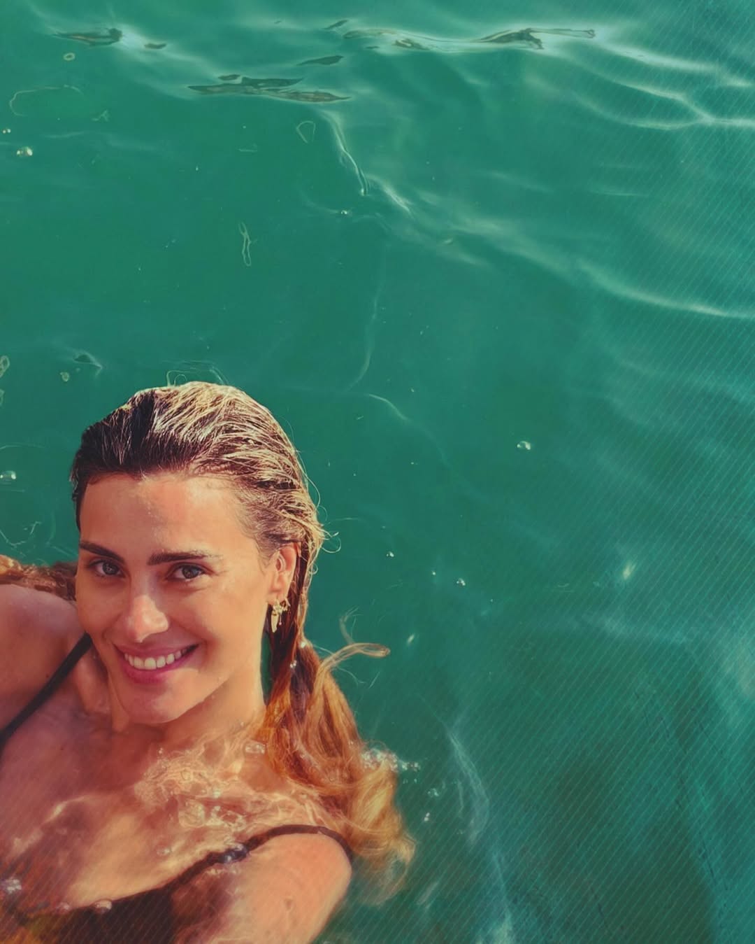 Carolina Dieckmmann exibe bronzeado durante férias na Bahia. Foto: Instagram