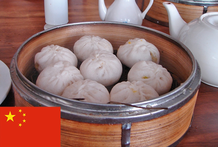 18º lugar - Baozi (China) -  Pão cozido no vapor de origem chinesa, com aspecto de coque, que leva diversos recheios.  Reprodução: Flipar