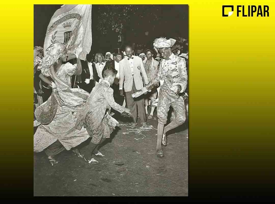 Dentre os nove quesitos avaliados, um deles destaca-se pela beleza e graciosidade da dança. O casal de mestre-sala e porta-bandeira tem a responsabilidade de seguir uma tradição do mundo do samba e defender o pavilhão da agremiação que representa. Veja a história.  Reprodução: Flipar