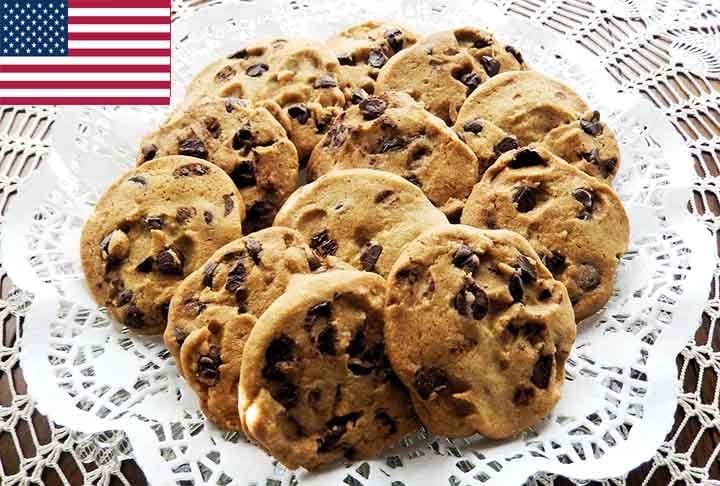 7º) Chocolate chip cookie (EUA): Típico cookie americano feito com uma massa básica de farinha, açúcar, manteiga e ovos. Além disso, é incrementado com pedaços de chocolate, geralmente na forma de gotas.  Reprodução: Flipar