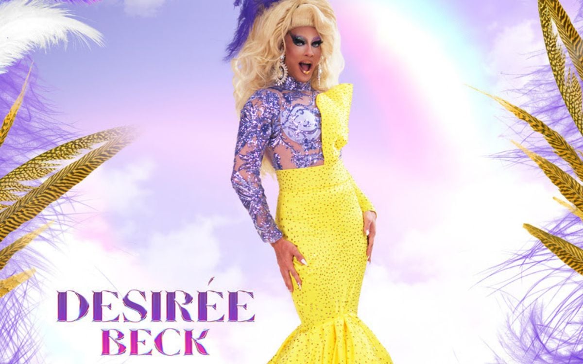 DesiRée Beck é uma queen ousada, conhecida por sua presença de palco e performances impecáveis e arrebatadoras. Natural do interior da Bahia, encontrou inspiração para sua drag em RuPaul’s Drag Race e escolheu seu nome como união do sonho infantil de ser uma estrela, com uma homenagem ao sobrenome da família de seu marido.

Fervente como um acarajé baiano, DesiRée já conquistou diferentes títulos em concursos de talento e beleza. O estilo de sua drag é marcado pela estética ‘perua’, onde mescla atitude e extravagância, que é um reflexo direto de sua personalidade vibrante.

Durante a pandemia, Desirée brilhou com a criação do TNT Drag, competição nacional que revelou nomes como Organzza, Tristan Soledade e Aquarela. Com um humor afiado, versatilidade e elegância, já foi uma das apresentadoras do Festival Realness e do Gongada Drag. Pronta para gongar no ‘reading challenge’, a queen promete risadas, looks e muita presença na Werk Room.. Foto: Divulgação
