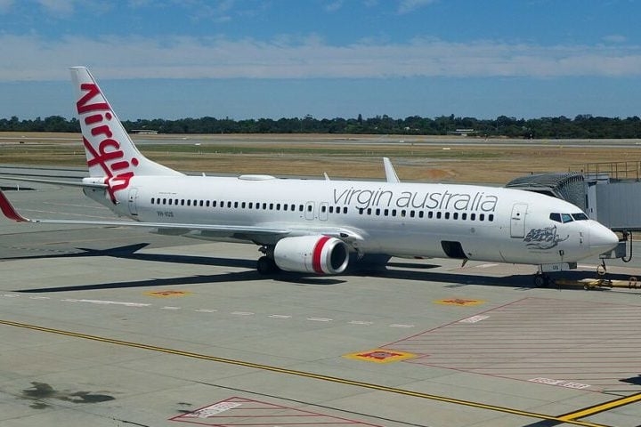 Tudo começou quando um passageiro avistou a cobra e gritou, alertando os demais. O avião era da companhia Virgin Australia. Reprodução: Flipar