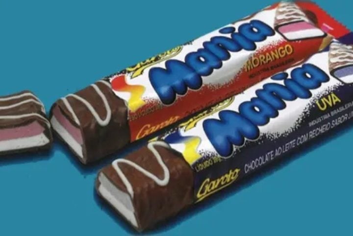 Mania, da Garoto: Esse chocolate foi lançado no fim dos anos 1990, vinha em formato de barrinha e tinha duas opções de sabores: morango e uva. Tem gente que pede a volta dele nas redes sociais até hoje! Reprodução: Flipar